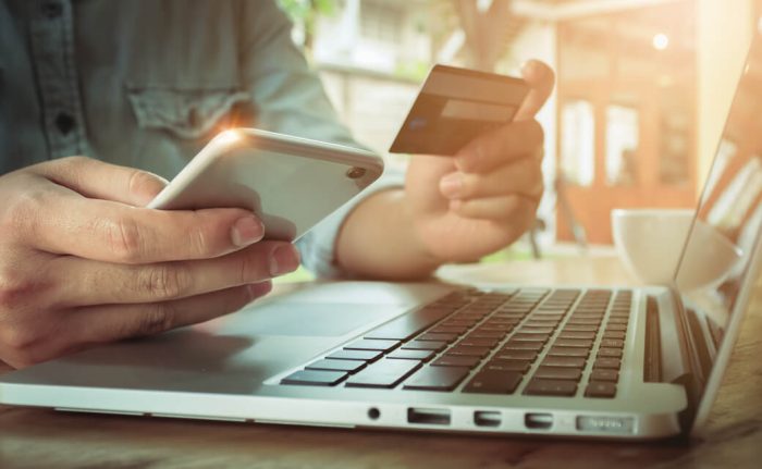 Man purchasing online with laptop