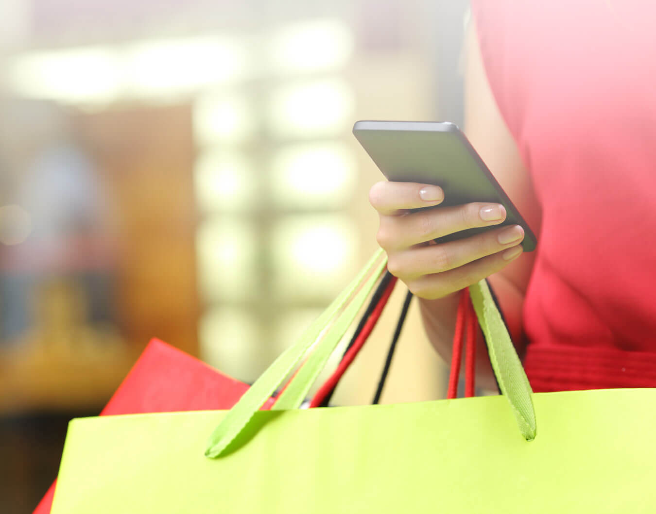 Woman out shopping on mobile device